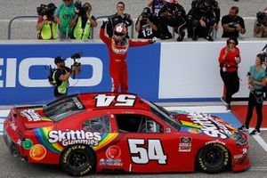 Kyle Busch, Joe Gibbs Racing, Toyota Supra Skittles Gummies celebrates his victory