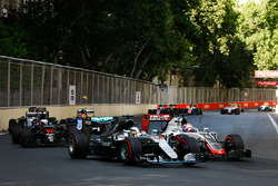 Lewis Hamilton, Mercedes AMG F1 W07 Hybrid and Romain Grosjean, Haas F1 Team VF-16 battle for positi