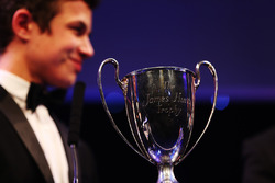 Lando Norris is presented with the British Club Driver of the Year trophy