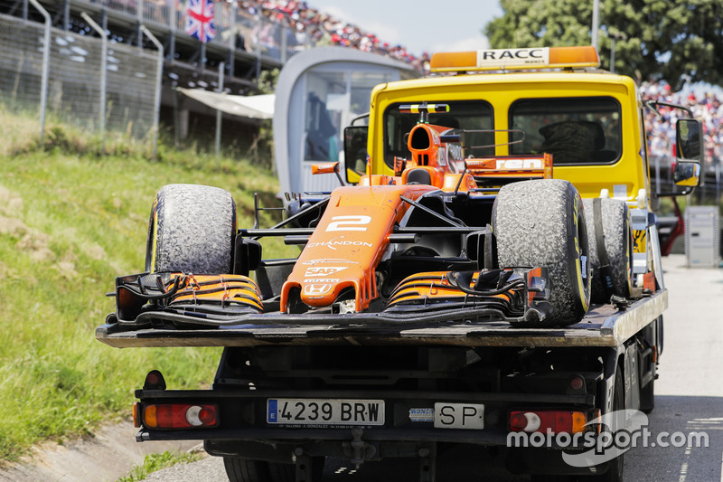 The car of Stoffel Vandoorne, McLaren MCL32, is returned to the garage on a flat bed truck