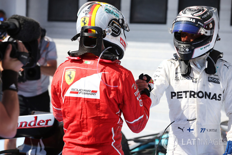 Valtteri Bottas, Mercedes AMG F1, congratulates winner Sebastian Vettel, Ferrari, in parc ferme