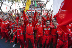 Ferrari team and mechanics celebrate in parc ferme
