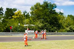 Marshals clear debris from the circuit