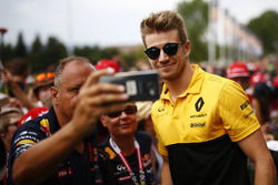 Nico Hulkenberg, Renault Sport F1 Team, poses for a picture, a fan