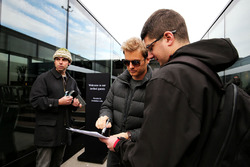 Nico Rosberg signs autographs for the fans