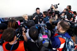 Surrounded by a media scrum, Eric Boullier, Racing Director, McLaren, is interviewed by Will Buxton