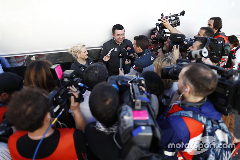 Surrounded by a media scrum, Eric Boullier, Racing Director, McLaren, is interviewed by Will Buxton