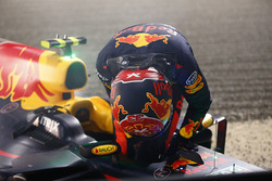 Max Verstappen, Red Bull Racing, climbs out of his car after retiring