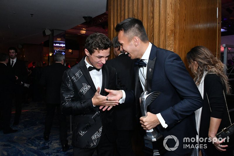 Lando Norris, McLaren, and Alexander Albon, Red Bull Racing, share a joke after the Awards ceremony