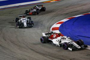 Charles Leclerc, Sauber C37, Marcus Ericsson, Sauber C37 and Kevin Magnussen, Haas F1 Team VF-18 