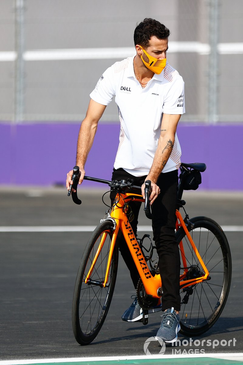 Daniel Ricciardo, McLaren, cycles the track
