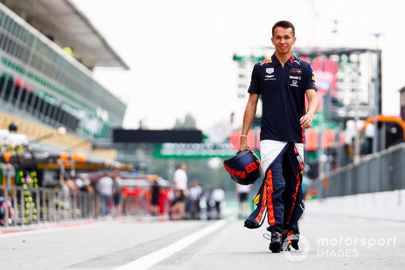 Alexander Albon, Red Bull Racing walks down the pit lane