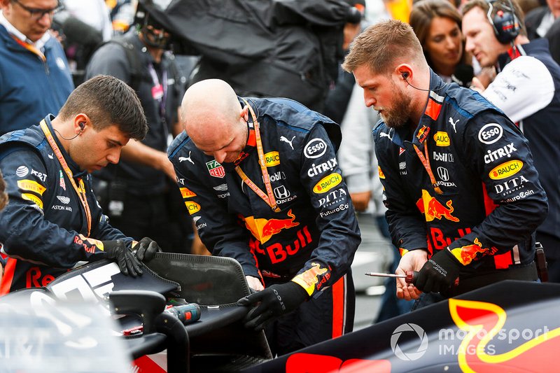 Red Bull mechanics at work on the grid