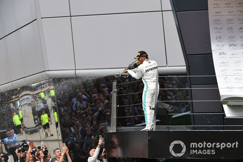 Lewis Hamilton, Mercedes AMG F1, 1st position, sprays Champagne from the podium