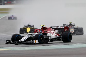 Antonio Giovinazzi, Alfa Romeo Racing C38, leads Kevin Magnussen, Haas F1 Team VF-19, and Daniel Ricciardo, Renault F1 Team R.S.19