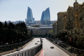 Kimi Raikkonen, Alfa Romeo Racing C38, leads Sergio Perez, Racing Point RP19