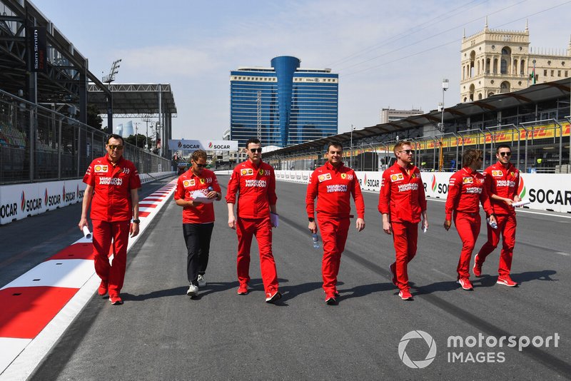 Sebastian Vettel, Ferrari walks the track with his engineers