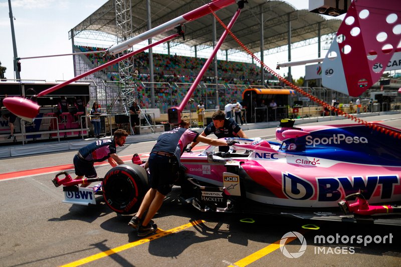 Lance Stroll, Racing Point RP19, is returned to the garage