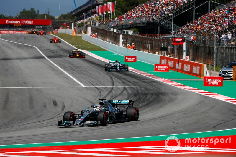 Lewis Hamilton, Mercedes AMG F1 W10, leads Valtteri Bottas, Mercedes AMG W10, and Max Verstappen, Red Bull Racing RB15