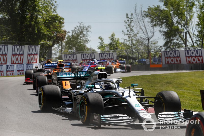 Valtteri Bottas, Mercedes AMG W10, leads Lando Norris, McLaren MCL34