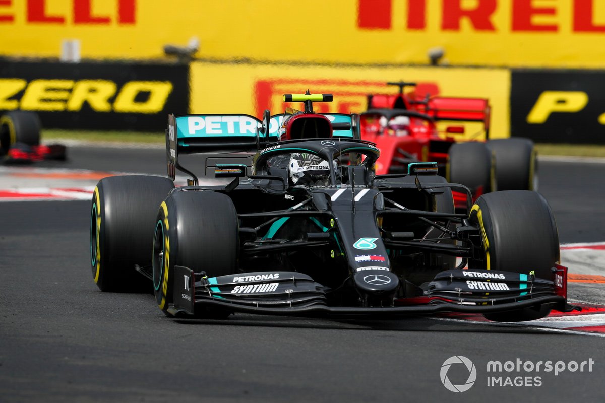 Valtteri Bottas, Mercedes F1 W11, leads Sebastian Vettel, Ferrari SF1000