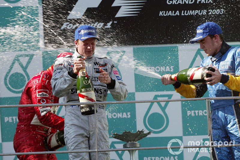 Podium: race winner Kimi Raikkonen, McLaren, third place Fernando Alonso, Renault