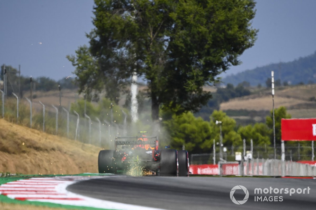 Sparks fly from the rear of Alex Albon, Red Bull Racing RB16