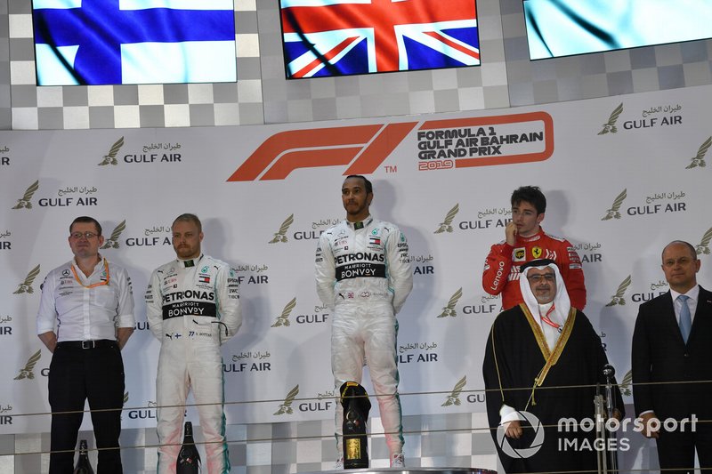 Valtteri Bottas, Mercedes AMG F1, 2nd position, Lewis Hamilton, Mercedes AMG F1, 1st position, and Charles Leclerc, Ferrari, 3rd position, on the podium