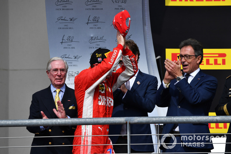Race winner Kimi Raikkonen, Ferrari celebrates on the podium