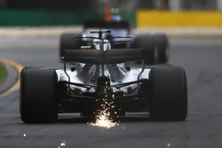 Sparks fly from the rear of Lewis Hamilton, Mercedes AMG F1 W08