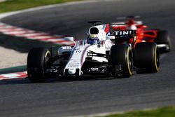 Felipe Massa, Williams FW40, leads Sebastian Vettel, Ferrari SF70H