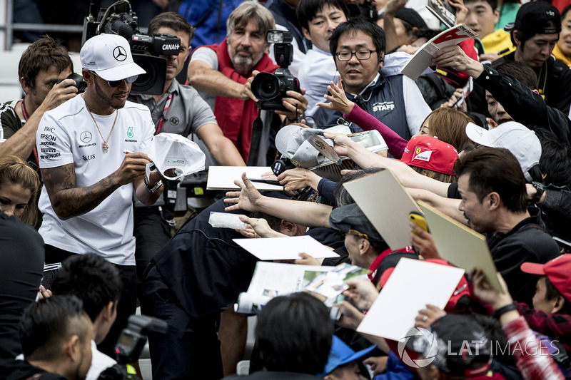 Lewis Hamilton, Mercedes AMG F1, signs autographs for fans