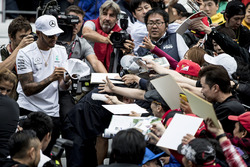 Lewis Hamilton, Mercedes AMG F1, signs autographs for fans