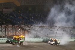 Track workers cleaning the track after the red flag