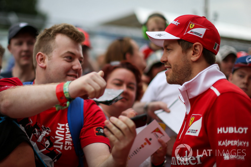 Sebastian Vettel, Ferrari signs autographs for the fans