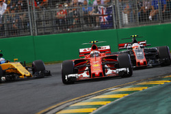 Kimi Raikkonen, Ferrari SF70H, leads Kevin Magnussen, Haas F1 Team VF-17 and Jolyon Palmer, Renault