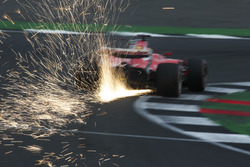 Sparks fly from the car of Sebastian Vettel, Ferrari SF70H