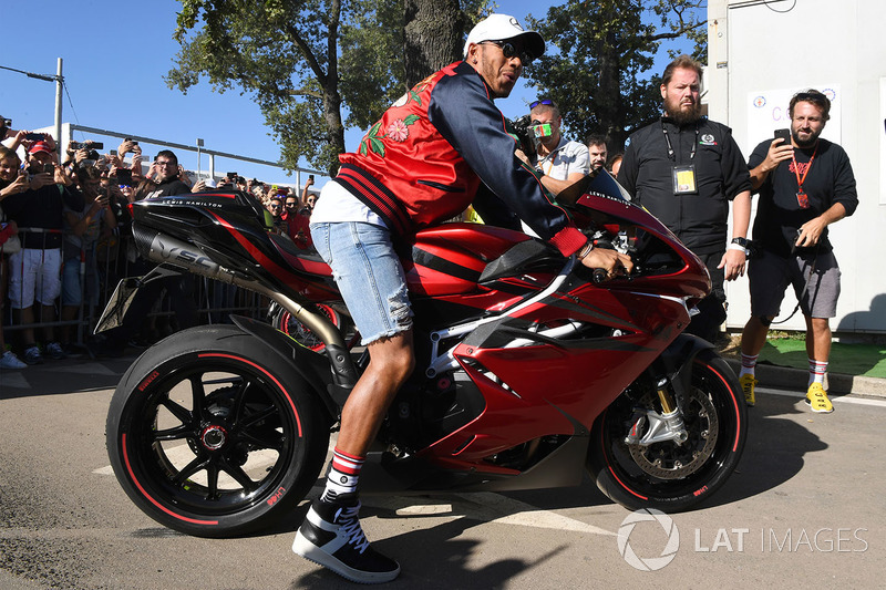 Lewis Hamilton, Mercedes AMG F1 arrives at the track on his motorbike