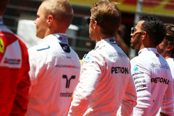 Nico Rosberg, Mercedes AMG F1 and Lewis Hamilton, Mercedes AMG F1 as the grid observes the national