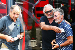 (L to R): Gerhard Berger, with Flavio Briatore, and Eddie Jordan