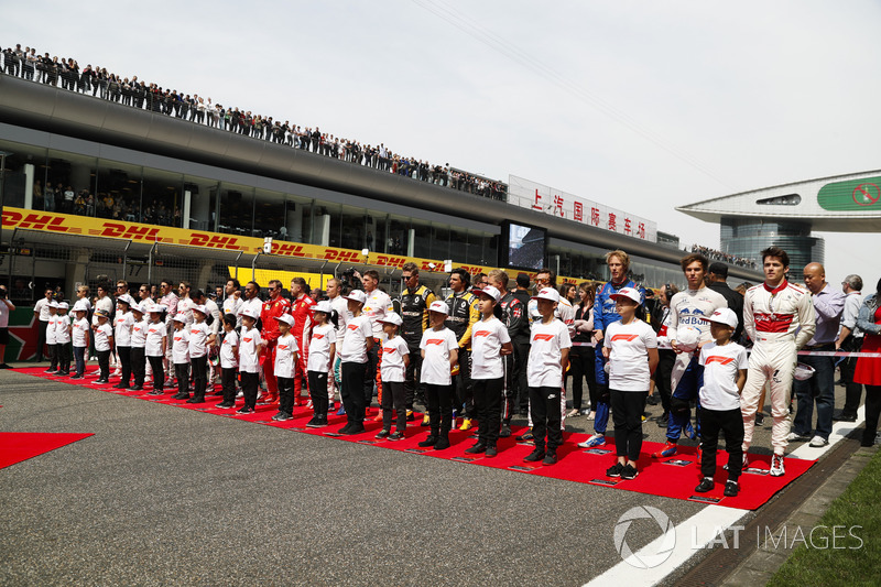 The drivers on the grid with mascots