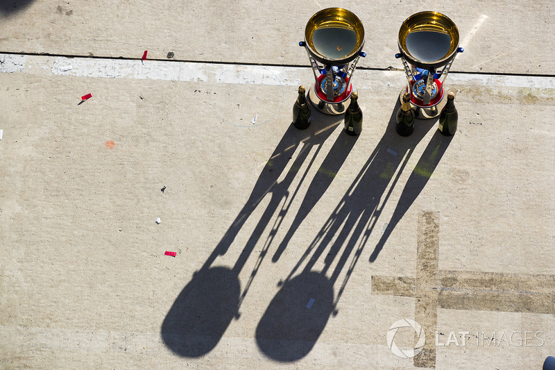 The winning driver and constructor trophies