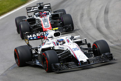 Sergey Sirotkin, Williams FW41, leads Romain Grosjean, Haas F1 Team VF-18