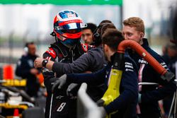 Romain Grosjean, Haas F1 Team, talks to team members after qualifying