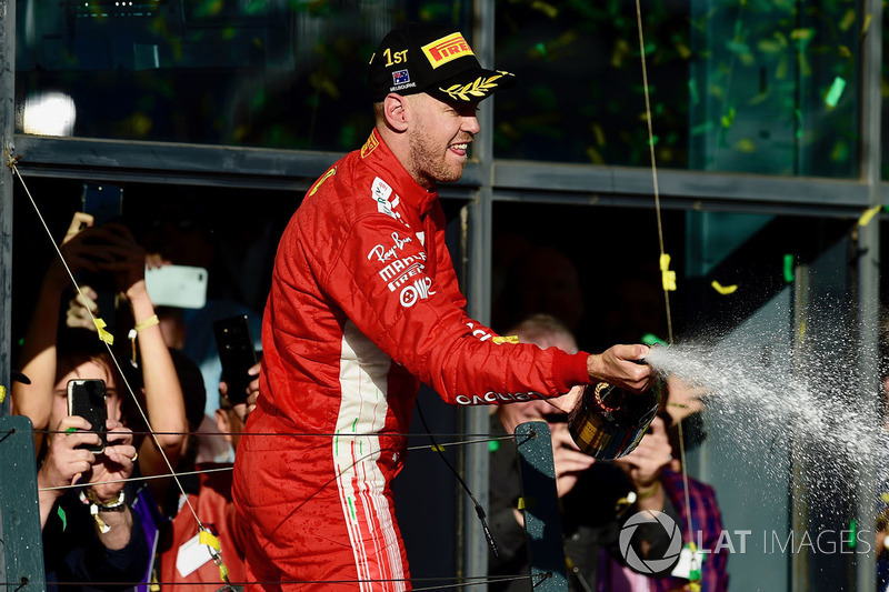 Race winner Sebastian Vettel, Ferrari celebrates on the podium with the champagne