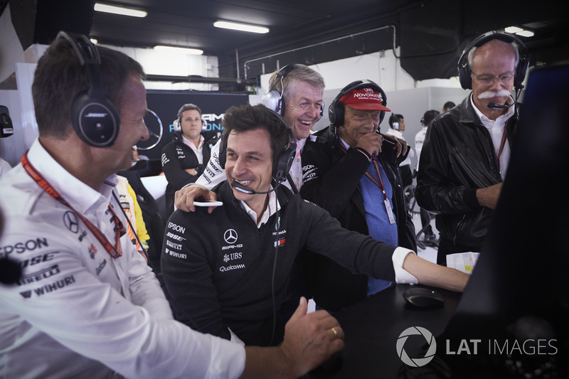 Toto Wolff, Executive Director (Business), Mercedes AMG, Niki Lauda, Non-Executive Chairman, Mercedes AMG, Dr Dieter Zetsche, CEO, Mercedes Benz, and others celebrate after their drivers secure the front row