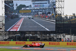 Sebastian Vettel, Ferrari SF70H on lap 2 and Lewis Hamilton, Mercedes-Benz F1 W08 in pit lane on the screen