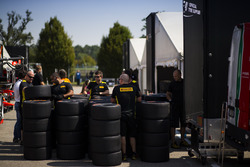 Pirelli staff unpack tyres in the paddock