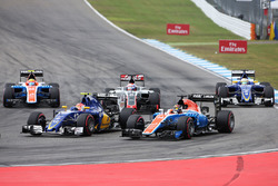 Felipe Nasr, Sauber C35 and Pascal Wehrlein, Manor Racing MRT05 at the start of the race