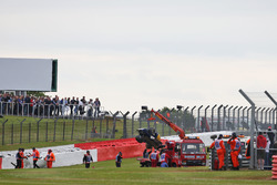 The Sauber C35 of Marcus Ericsson, Sauber F1 Team is recovered back to the pits on the back of a tru